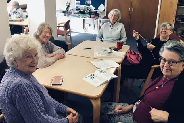 Members of Peacehaven Happy Club catching up over crafts and crosswords