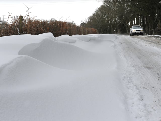 Big snow drifts built up near Monks Gate in March 2013