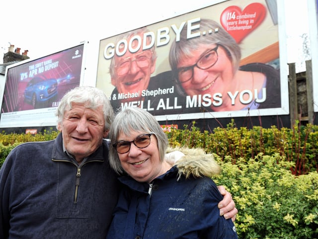Tan and Michael Shepherd in front of the Littlehampton billboard dedicated to them. Picture: Kate Shemilt ks190080-3
