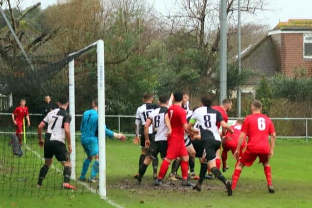 Goalmouth action before the game was abandoned / Picture: Roger Smith