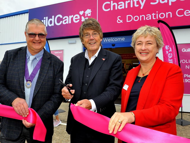 TV and radio presenter Mike Read cuts the ribbon to open the new Guild Care superstore and donation centre in Littlehampton, with chief executive Suzanne Millard and deputy mayor David Chace. Picture: Steve Robards SR03101901