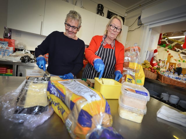 Surviving Christmas charity setting up on Christmas Eve at the Salvation Army hall in St Andrew's Sqaure, Hastings.
Dee Wentworth and Jan Murphy SUS-191224-110240001