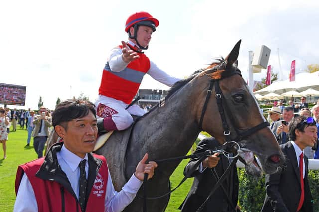 Oisin Murphy and Deirdre come into the winner's enclosure after their historic win in the Qatar Nassau Stakes - the first win for a Japanese-trained horse at Goodwood / Picture by Malcolm Wells