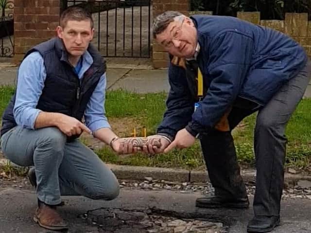 Martin McCabe and Bob Smytherman 'celebrated' with a cake and candles by the hole on Palatine Road