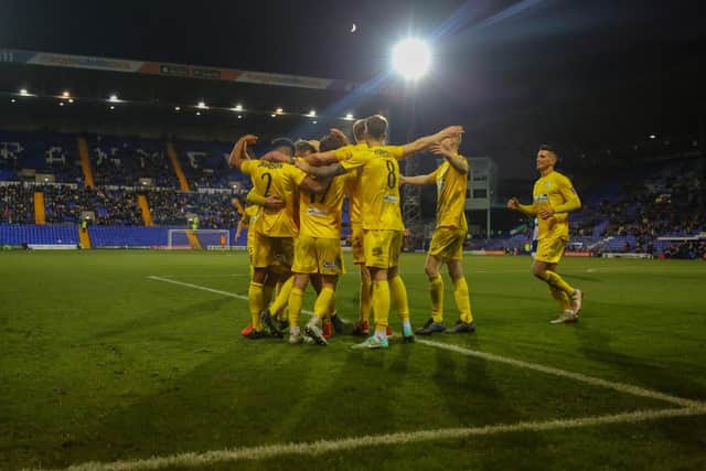 Chi City's players celebrate Ryan Peake's consolation goal at Tranmere - the moment that proved the perfect ending to their FA Cup run / Picture: Jordan Colborne