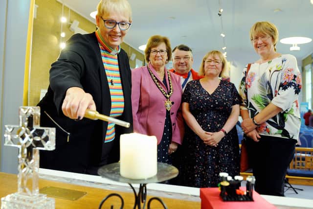 Lighting the candle to launch Worthing Mental Health Awareness Week, Dawn Carn, minister at Offington Park Methodist Church, with Worthing mayor Hazel Thorpe, co–founders Bob Smytherman and Carol Barber, and Val Turner, executive member for health and wellbeing on Worthing Borough Council. Picture: Kate Shemilt ks190553-1