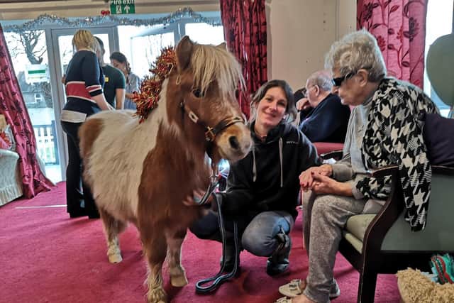 Fidget the miniature Shetland pony with Sophie and Andree, 90, at St Winefrides care home in St Winefride's Road, Littlehampton