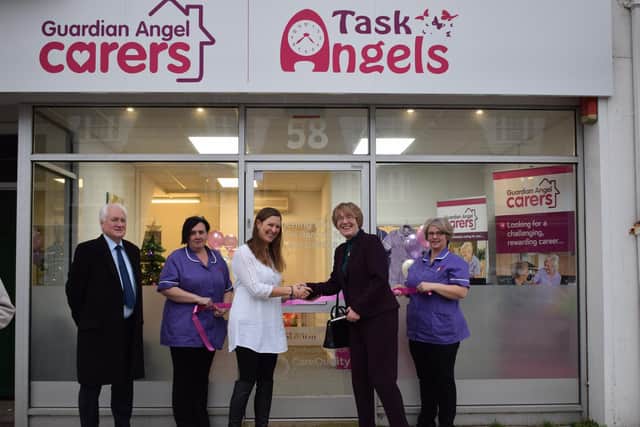 Christina Bassadone joined by staff, clients and borough and county councillors to open the Guardian Angel Carers office on Goring Road