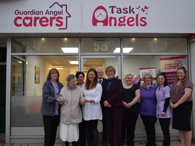 Christina Bassadone joined by staff, clients and borough and county councillors to open the Guardian Angel Carers office on Goring Road