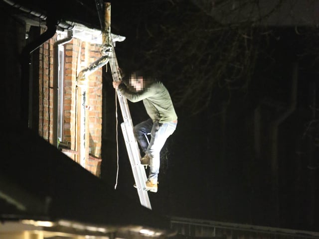 After a tense two hours, the men finally agreed to come down from the roof.