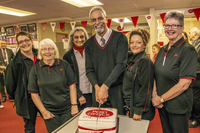 Mac and Naina Patel with staff at the Rose Green Post Office 25th anniversary celebrations