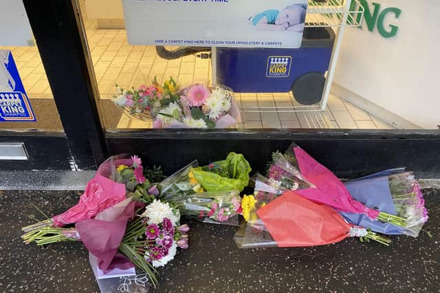 Flowers left outside the dry cleaners in Hassocks
