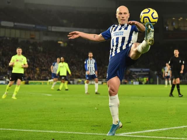 Brighton and Hove Albion's key midfielder Aaron Mooy injured his knee in training and is doubtful for Everton