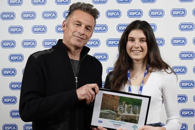 Sophie Garwood collecting her award from host Chris Packham at the awards ceremony at the Tower of London
