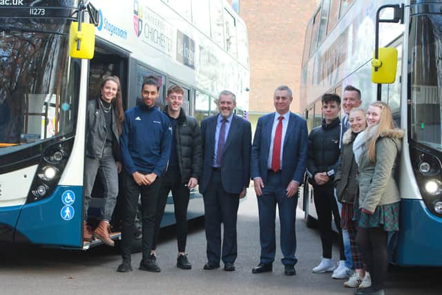Students and staff with the new buses