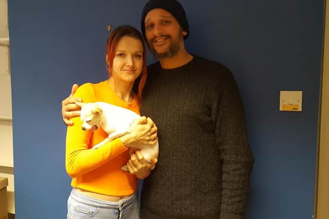 Gemma Howell and Dale Davies with their dog, Missie