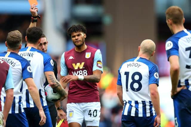 Brighton and Hove Albion's Aaron Mooy was sent off at Villa Park following a foul on Jack Grealish