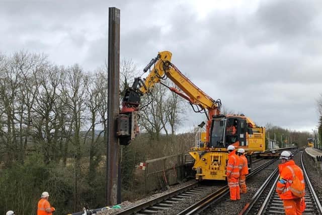 Work being carried out to create the steel wall to shore up the landslip. Photo by Network Rail