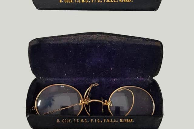Two pairs of glasses in a blue case