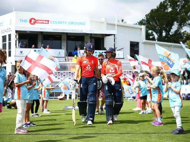 Amy Jones and Danni Wyatt walk out to bat for England at The 1st Central County Ground last summer