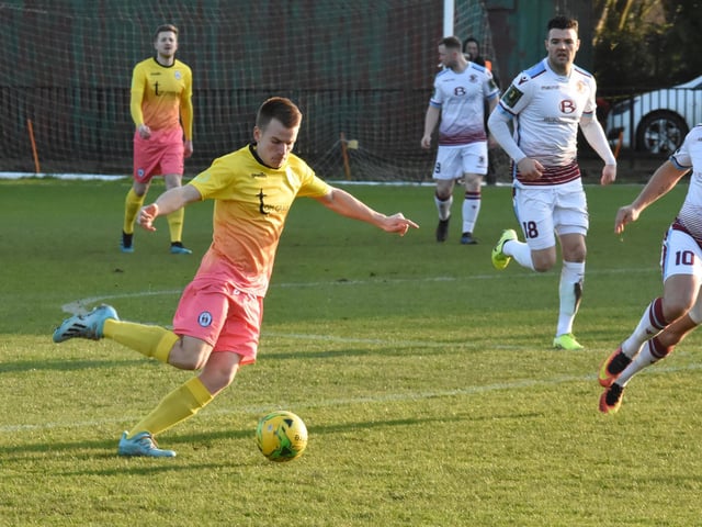 Keiran Rowe passes the ball.