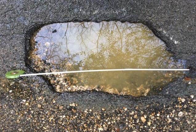 A couple have been left with more than ?600 worth of repair costs after their car hit the worst pothole in Midhurst. SUS-200122-130749001