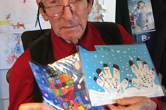 Raymond Briggs with the two winning drawings
