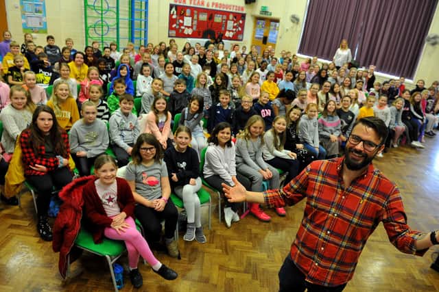 Dave Burrows, music lead at Summerlea CP School, with children from his school and four others, Rustington Community Primary School, Georgian Gardens Primary School, White Meadows Primary Academy and East Preston Junior School, at the rehearsal get-together. Picture: Steve Robards SR20011102