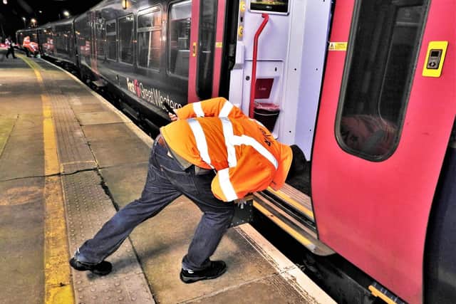 A member of the survey team measures the clearances at Worthing station. Picture: John Vaughan