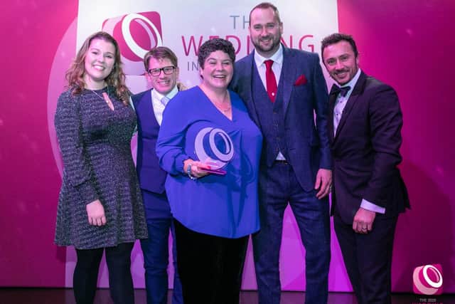 Amanda Millis, weddings and functions manager, with the team from Field Place Manor House & Barns accepting the national award for best town or city wedding venue