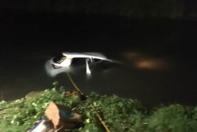 The car submerged in the water