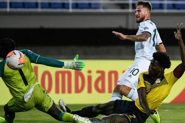 Argentine midfielder Alexis Mac Allister scores past Ecuadorean goalkeeper Wellington Ramirez during their under-23 South American Pre-Olympic Tournament