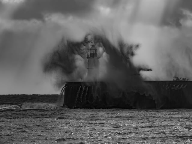 Newhaven Harbour arm in stormy weather by Marcus Berrisford. "Conditions were a bit challenging when I took this one. Driving rain, sea spray, a gale so strong I could hardly stand up and, despite all that, sunlight so bright it threatened to over expose the picture. Good fun though!" he said. SUS-200130-093652001
