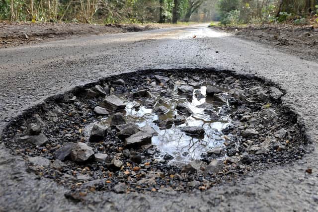 Pothole in Byfleets Lane. Pic Steve Robards SR20020701 SUS-200702-132244001