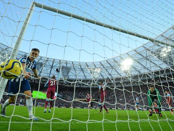 Leandro Trossard watches Glenn Murray's effort hit the net