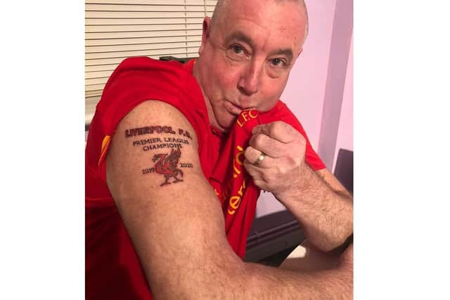 Mark Gretton, 53, with his Liverpool Premier League Champions 2019/20 tattoo