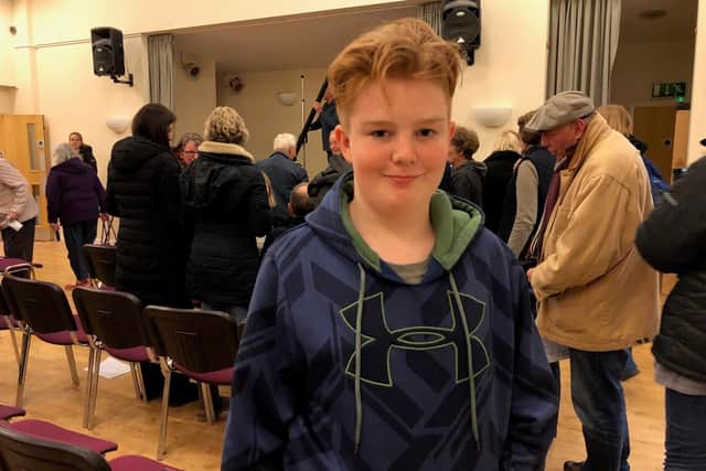 Cameron Hill was the youngest of more than 100 residents, who filled a village hall to share their views on plans to build 35 homes in Fishbourne SUS-200402-152839001