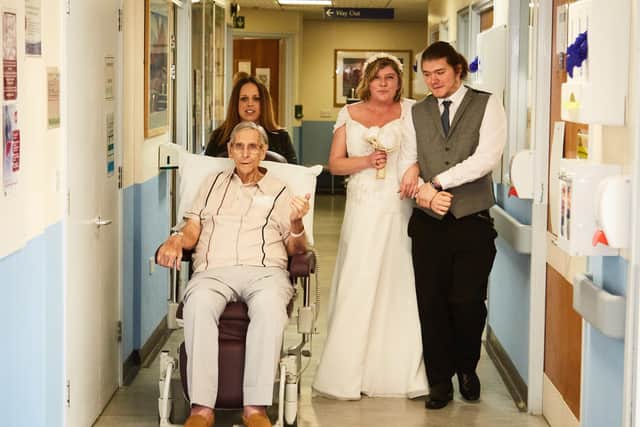 Samantha Oates is walked down the aisle on Fisbourne ward by her father-in-law Peter and son Steven - Picture by Tobias Key Photography