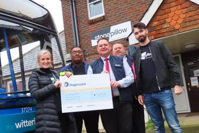 Staff from Stagecoach's Chichester depot handing over the cheque for ?1,030 to Eva Parker-Knight and Ryan Cavana from Stonepillow