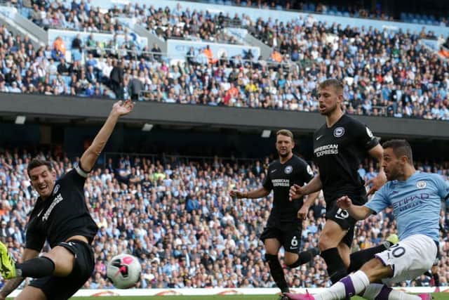 Lewis Dunk makes a last ditch tackle against Manchester City at the Etihad