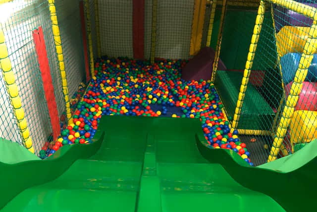 A slide into the ball pit keeps children entertained