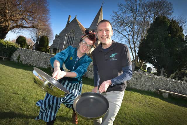Organisers of the Alfriston pancake race Penny Macleod and Martin Pite in front of St Andrew's Church. Photograph: Justin Lycett/ SUS-201202-122832001