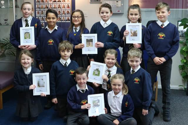 Children from each class at St Margaret’s Primary School with their toilet twinning certificates