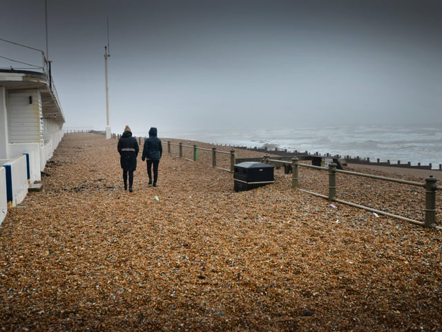 Shingle from Marina Beach covering the promanade, St Leonards, after the recent high winds. SUS-200216-104433001