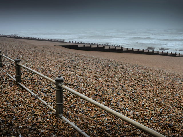 Shingle from Marina Beach covering the promanade, St Leonards, after the recent high winds. SUS-200216-104338001