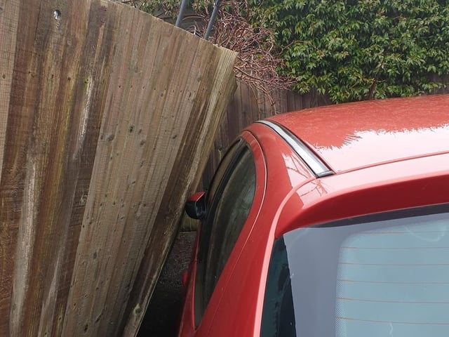 A precariously positioned fence in Eastbourne SUS-200216-143555001