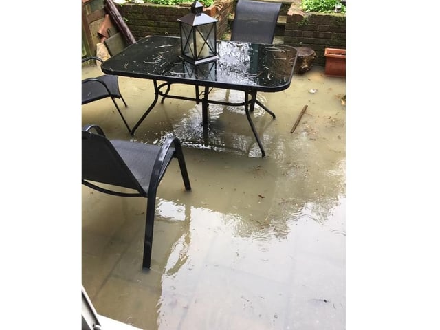 This patio was under a fair amount of water in North Heath Lane, Horsham SUS-200216-143707001