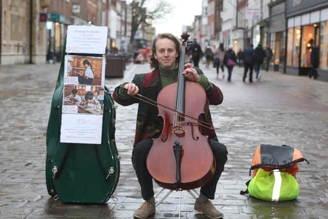 DM2022217a.jpg Chichester busker Will Dodd raises £1,000 for Cambodia charity. Photo by Derek Martin Photography SUS-200218-190822008