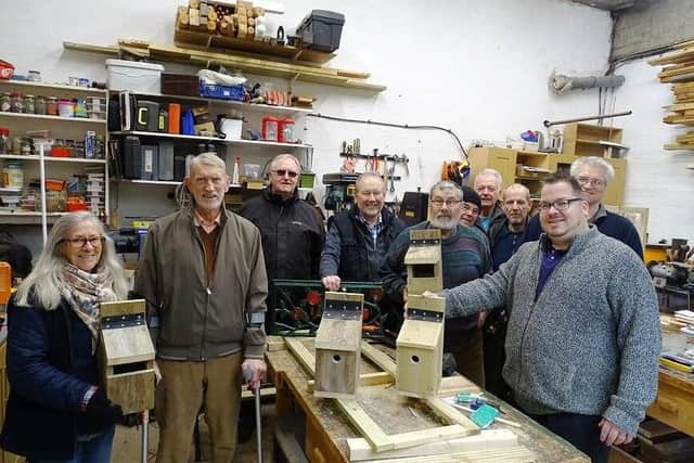 Members of the Friends of Mewsbrook Park and Littlehampton East Men In Sheds with examples of the bird boxes