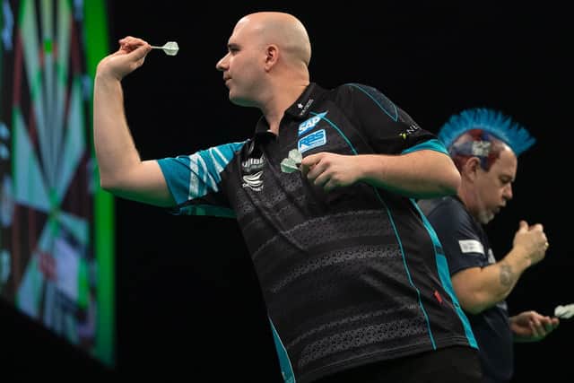 Rob Cross in action in his match against Peter Wright. Picture by Lawrence Lusting/PDC